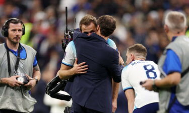 Gareth Southgate consoles Harry Kane after England's defeat to France.