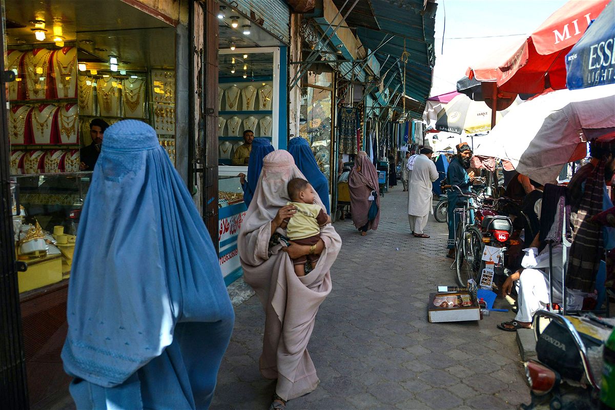 <i>Javed Tanveer/AFP/Getty Images/File</i><br/>Afghan women walk along a market at Chaharso square in Kandahar on August 4