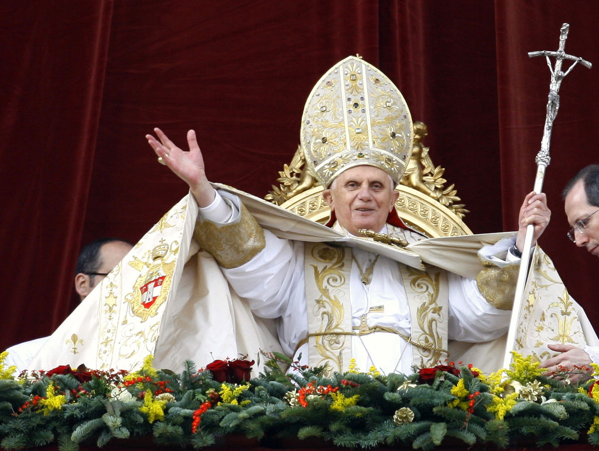 Pope Benedict XVI greets the faithful to deliver his 