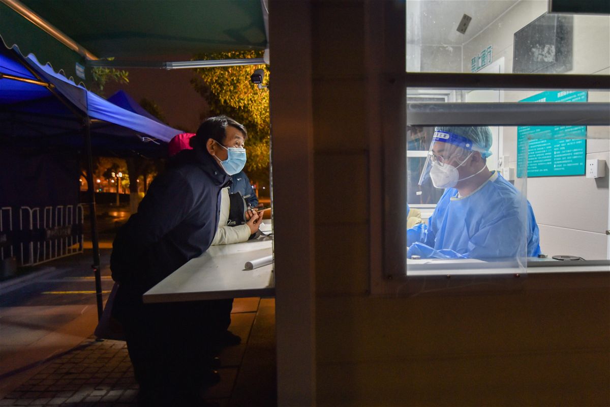 <i>CFOTO/Future Publishing/Getty Images</i><br/>Citizens seek treatment at a night clinic in Nanjing
