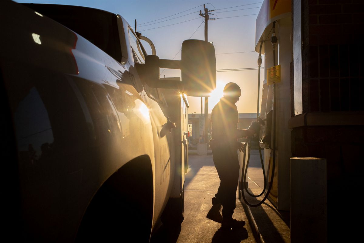 A person finishes pumping gas at a Shell gas station on April 01