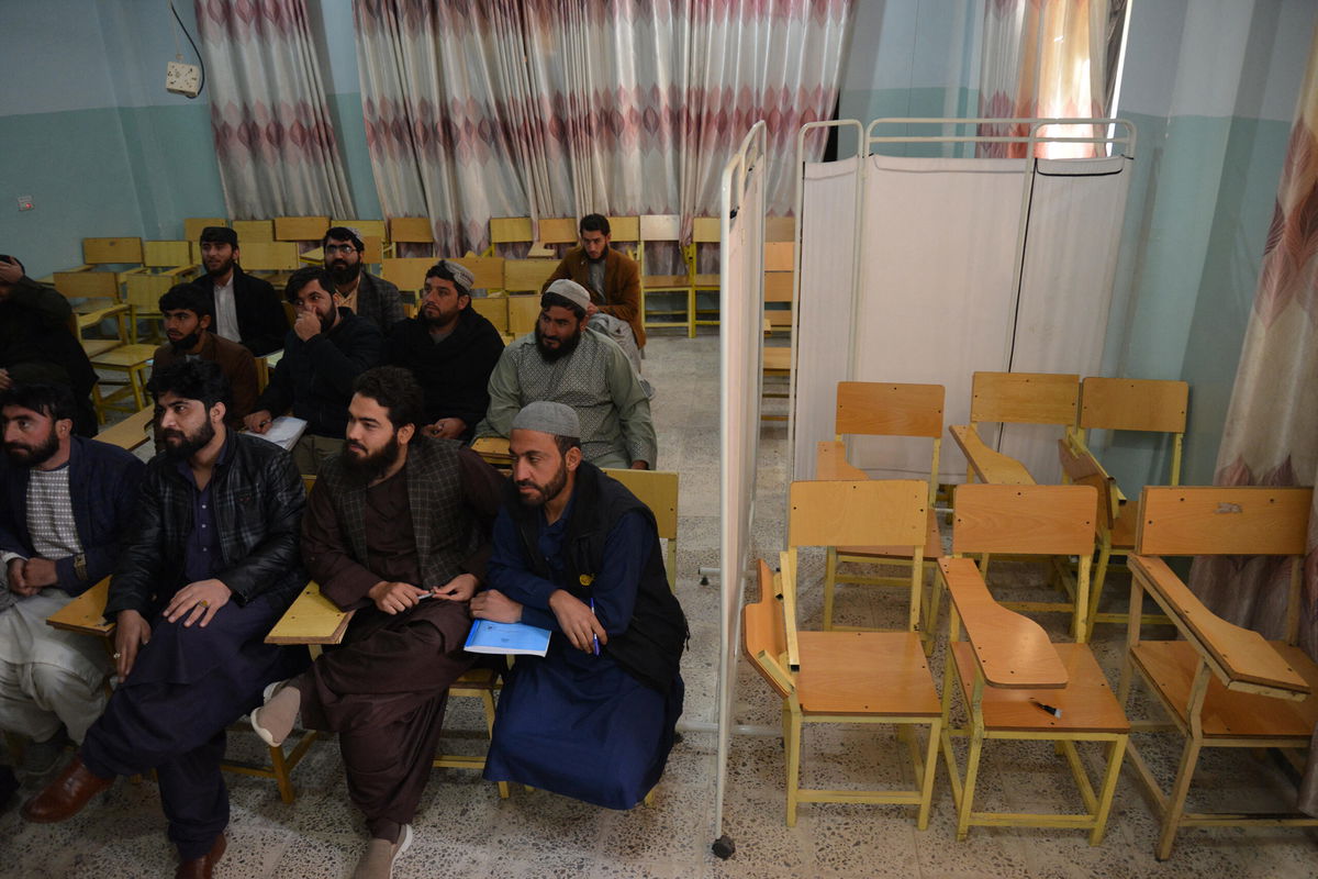 <i>Stringer/AFP/Getty Images</i><br/>Male students attend a class behind a curtain meant to separate men from women at a university in Kandahar province