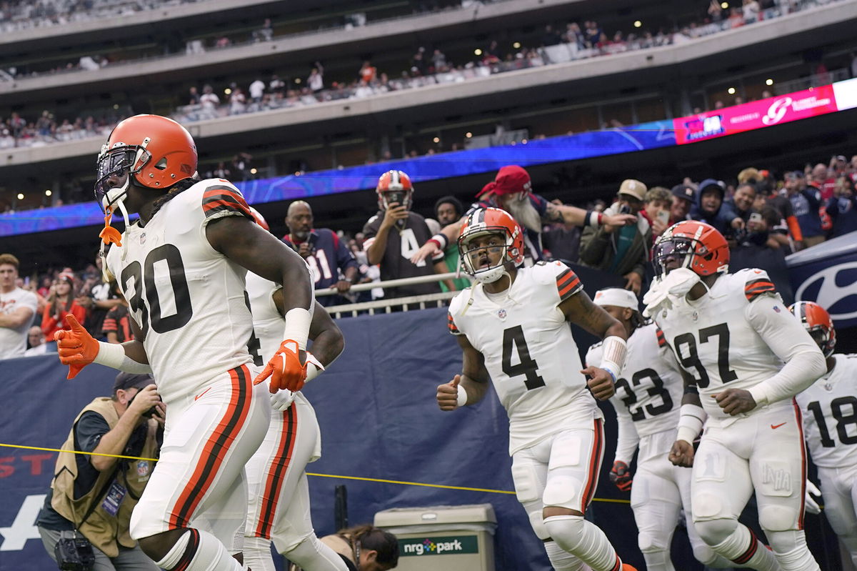 <i>Eric Gay/AP</i><br/>Watson runs onto the field with his team for the game against the Texans.