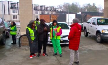 Hundreds of cars lined up around the block and on Keosauqua Way Saturday morning waiting to celebrate the Rev. Rob Johnson's 35th birthday with free gas and a slice of Kum & Go breakfast pizza.