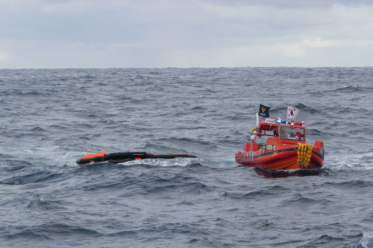 <i>/The Korea Coast Guard/AP</i><br/>A South Korea Coast Guard vessel searches for crew from a capsized ship in waters between South Korea and Japan on January 25