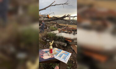 Debris is scattered outside the home.