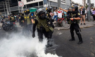 Police are pictured in the capital Lima on Wednesday.