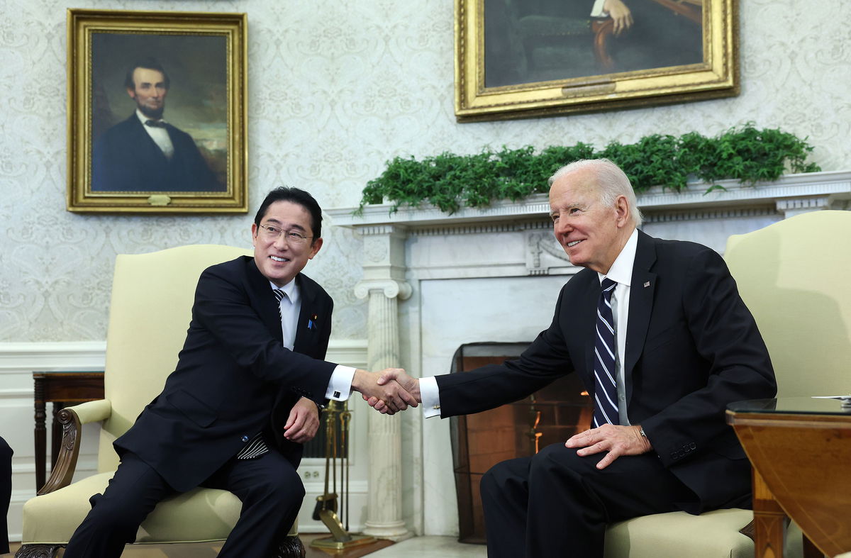 <i>Kevin Dietsch/Getty Images</i><br/>US President Joe Biden and Japanese Prime Minister Fumio Kishida shake hands during a meeting in the Oval Office at the White House in Washington