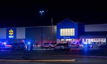 Emergency responders work the scene of a shooting at the West Side Walmart located in Evansville