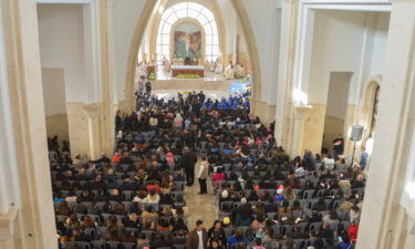 Worshipers attend a mass inside the Church of the Baptism of Lord Jesus Christ in Jordan Valley