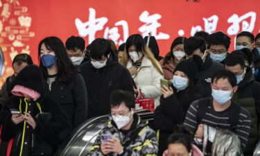 Commuters at a subway station in Shanghai