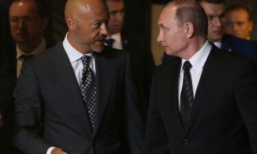 Russian President Vladimir Putin listens to film director Fyodor Bondarchuk while visiting the Lenfilm film production studio in June 2016 in Saint Petersburg.