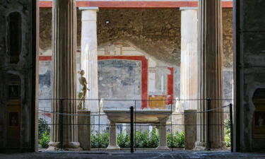 The courtyard of the House of the Vettii with a statue of Priapus