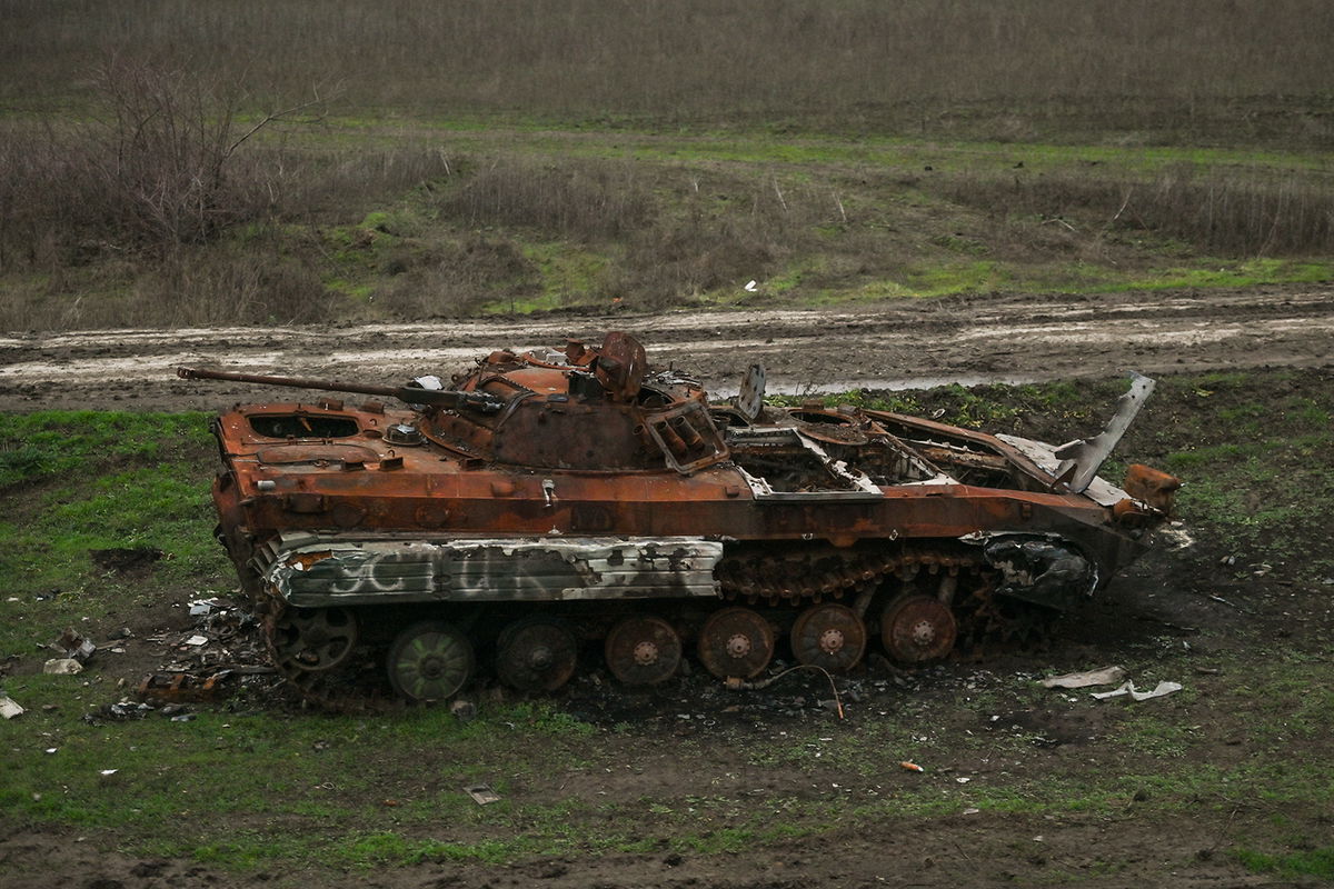 <i>Artur Widak/NurPhoto/Getty Images</i><br/>Destroyed Russian armored car standing by the railway line seen from the window of an evacuation train from Kherson to Khmelnytskyi