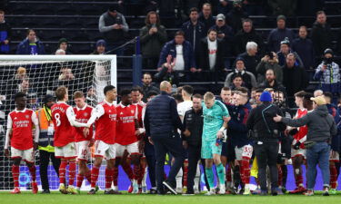 Aaron Ramsdale (in teal) is escorted away shortly after the end of Sunday's match.