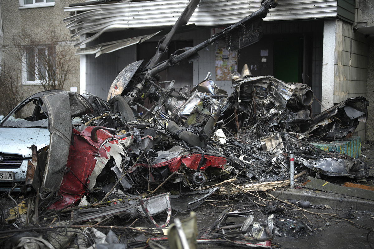 A view of the scene where a helicopter crashed on civil infrastructure in Brovary, on the outskirts of Kyiv, Ukraine, Wednesday, Jan. 18, 2023. The chief of Ukraine's National Police says a helicopter crash in a Kyiv suburb has killed 16 people, including Ukraine's interior minister and two children. He said nine of those killed were aboard the emergency services helicopter. (AP Photo/Daniel Cole)