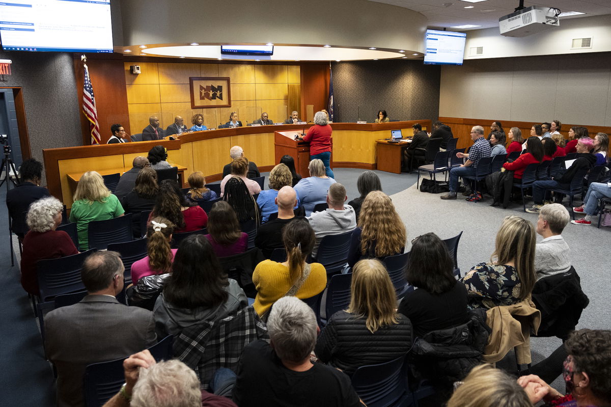 <i>Billy Schuerman/The Virginian-Pilot/AP</i><br/>Community members pack into the Newport News Public Schools Administration building on January 17 in Newport News