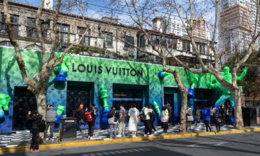 People posing for photos at a pop-up Louis Vuitton shop in Shanghai in January 2022.