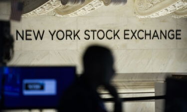 Traders work on the floor at the New York Stock Exchange in New York