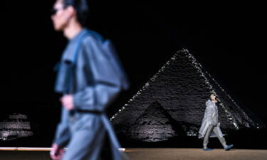 Models walk in a menswear show at the Giza Pyramids in Egypt