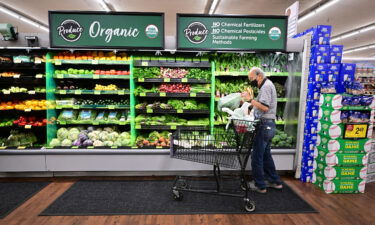 A shopper looks at organic produce at a supermarket in Montebello