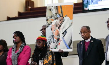 Family members and supporters hold a photograph of Tyre Nichols at a news conference in Memphis