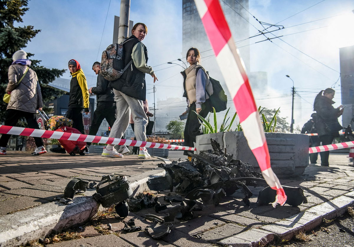 <i>Vladyslav Musiienko/Reuters</i><br/>Residents look at parts of an unmanned aerial vehicle