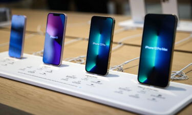 Apple is raising the price of iPhone battery replacements. Models of the newly released iPhone 13 are here displayed at an Apple Store.