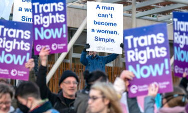 Members of the Scottish Family Party protest alongside supporters of the Gender Recognition Reform Bill outside the Scottish Parliament