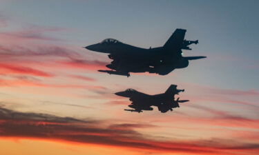 F-16 Fighting Falcons from Eglin Air Force Base fly over a high school football game in Niceville