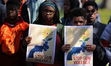 Several hundred high school students from the Washington area observe 19 minutes of silence while rallying in front of the White House before marching to the US Capitol to protest against the National Rifle Association and to call for stricter gun laws April 20