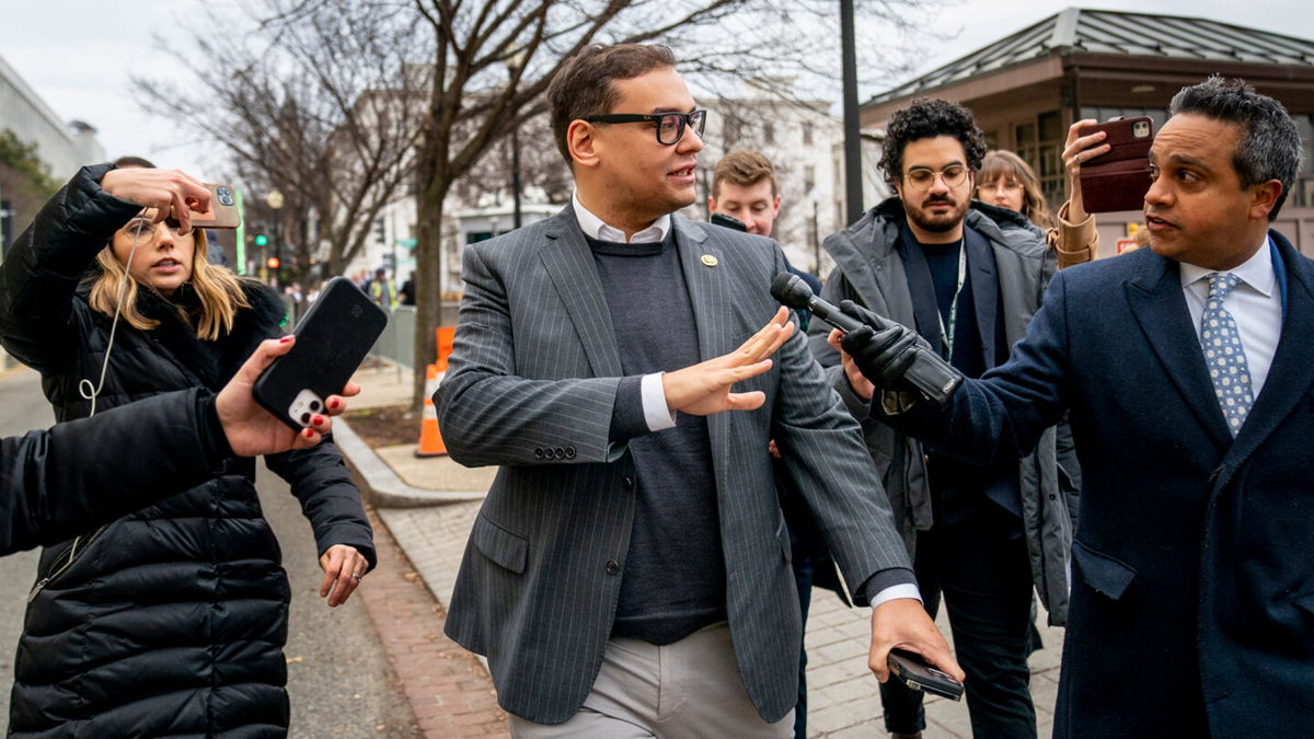 <i>Andrew Harnik/AP</i><br/>New York Rep. George Santos leaves a House GOP Conference meeting on Capitol Hill in Washington