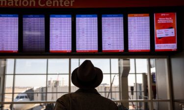 Passengers pass through Dallas-Fort Worth International Airport on January 11.