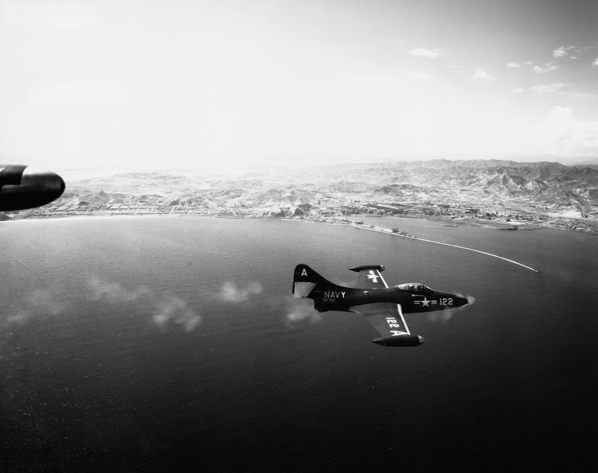 <i>Corbis/Getty Images</i><br/>A Grumman F9F Panther fighter jet fires its guns during an attack on the North Korean port of Hungnam in 1951.