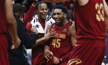 Cleveland Cavaliers guard Donovan Mitchell (45) celebrates with teammates after making a basket to tie an NBA basketball game during the second half against the Chicago Bulls