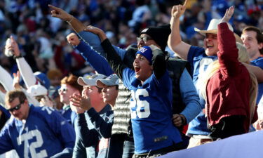 Giants fans celebrate a touchdown during the second quarter against the Colts.