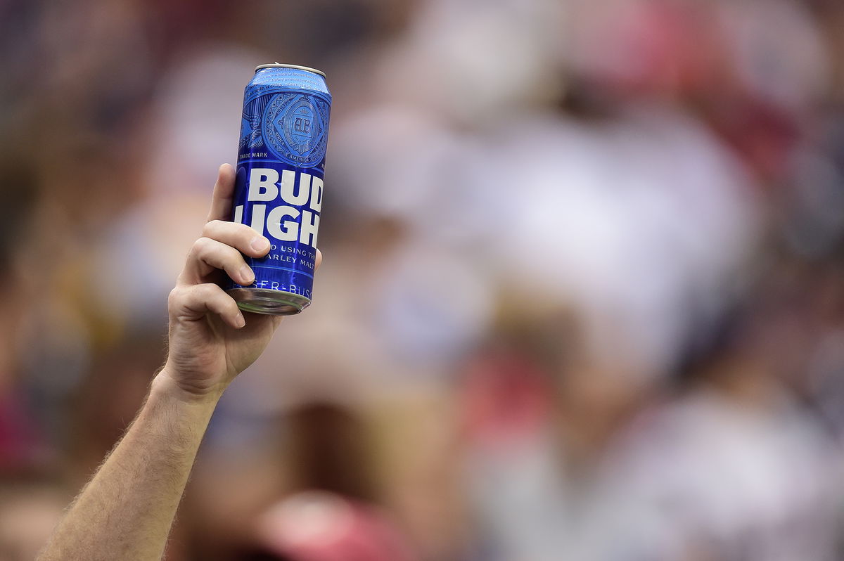 <i>Patrick McDermott/Getty Images</i><br/>Bud Light and Budweiser are getting a makeover at this year's Super Bowl. A fan holds up a can of Bud Light during a game on October 6