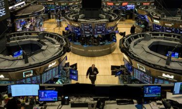 Traders work on the floor of the New York Stock Exchange during opening bell in New York City on January 18