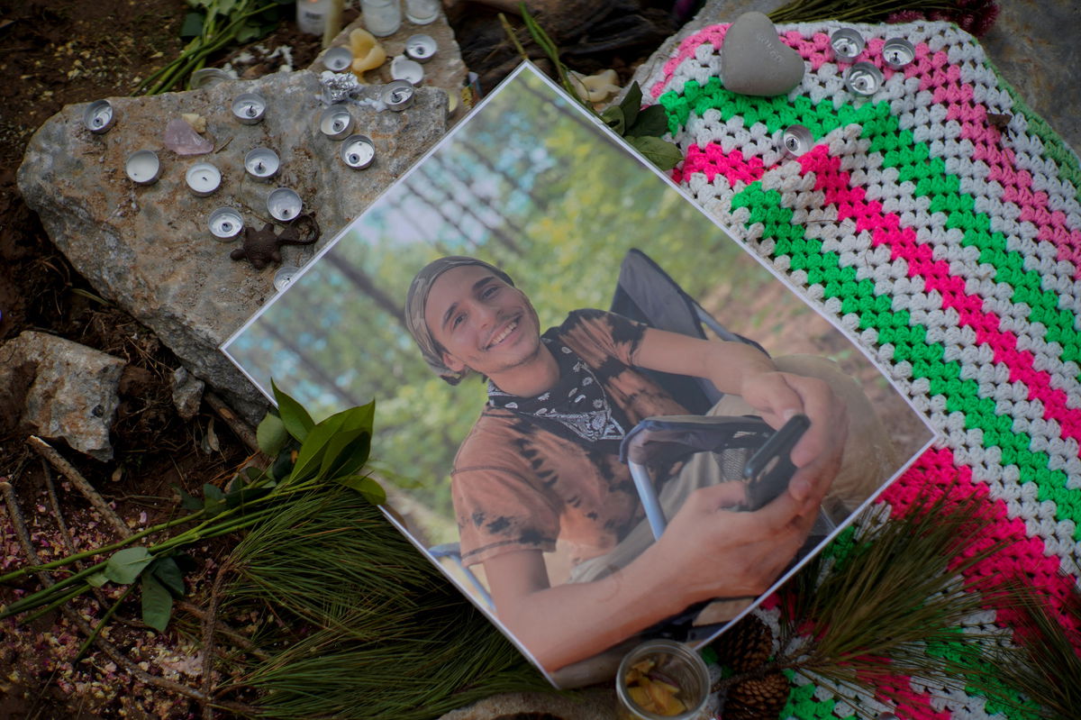 <i>Cheney Orr/Reuters</i><br/>A photograph of Manuel Terán is seen Saturday at a memorial site at the entrance to the park near Atlanta.