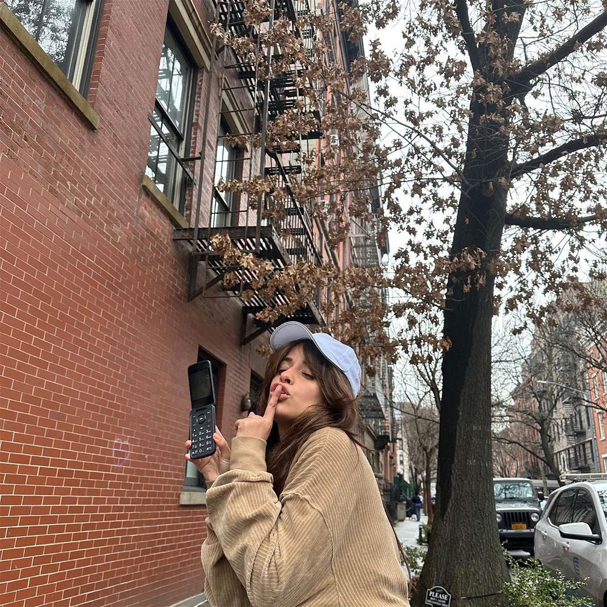 <i>From Camila Cabello/Twitter</i><br/>Camila Cabello with her flip phone. 