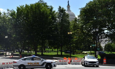 US Capitol police block a street during an investigation of a possible bomb threat near the US Capitol and Library of Congress in Washington