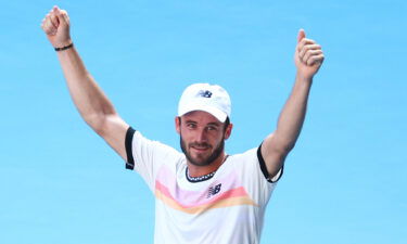 Tommy Paul celebrates after winning match point against Ben Shelton.