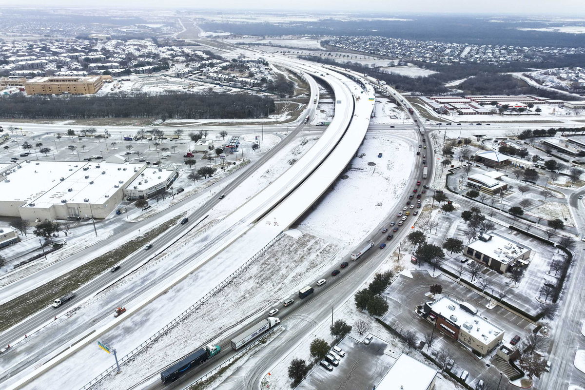 <i>Lola Gomez/The Dallas Morning News/AP</i><br/>An icy mix covers Highway 114 on Monday in Roanoke