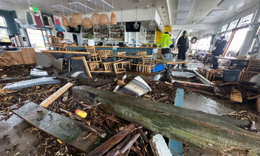 A support piece from the Capitola Wharf lies in the storm-damaged Zelda's restaurant in Capitola