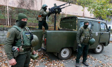 Ukrainian servicemen of National Guard operate with a homemade anti-aircraft machine gun to destroy drones in Mykolaiv