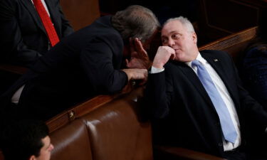 Now-House Majority Leader Steve Scalise talks to Rep. Andy Biggs in the House Chamber during the third day of elections for Speaker of the House on January 5. House Republicans approved a rules package for the 118th on January 9.