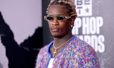 Grammy-winning rapper Young Thug and a racketeering co-defendant conducted a hand-to-hand drug transaction during a court hearing