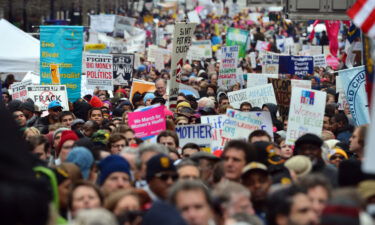 Thousands of people march through through downtown Raleigh