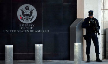 A Spanish policeman stands guard near the US embassy in Madrid