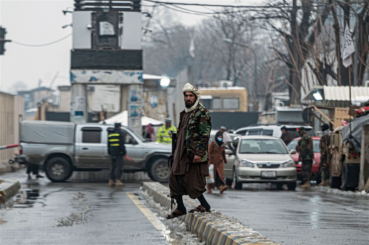 <i>Wakil Kohsar/AFP/Getty Images</i><br/>A Taliban security guard is pictured here on a blocked road after a blast near Afghanistan's Foreign Ministry at Zanbaq Square in Kabul on January 11.